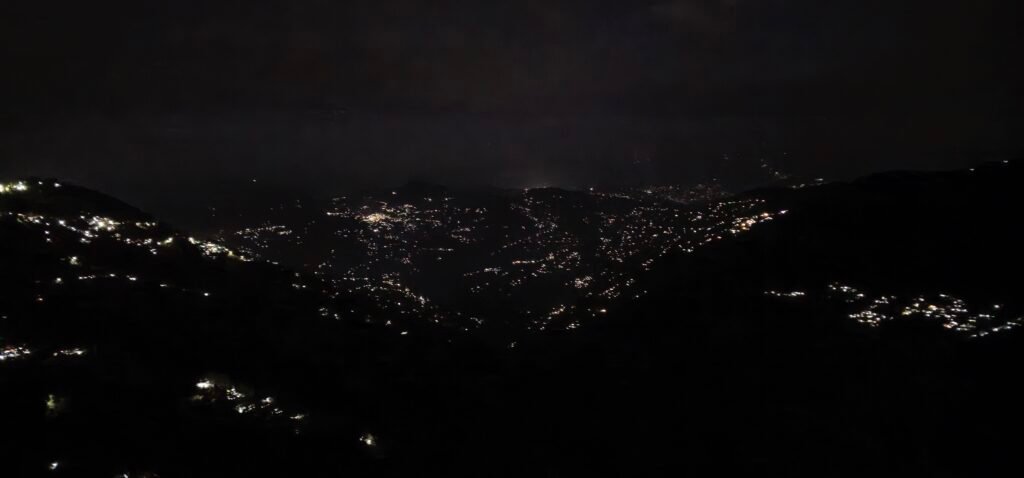 Rooftop cafe with full Moon and Twinkling Valley lights