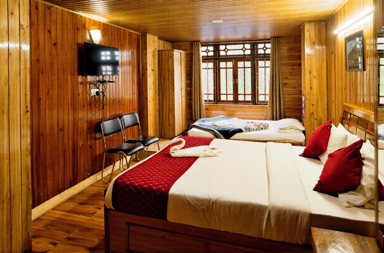 Deluxe mountain view triple occupancy room near Mall Road Darjeeling with wooden interiors